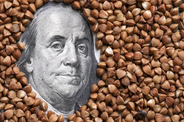 Buckwheat grains on bank note — Stock Photo, Image