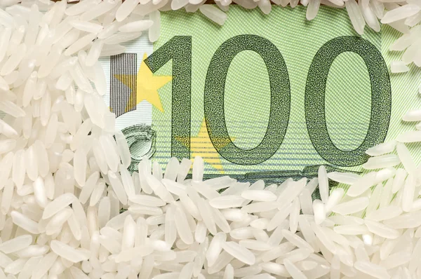Rice grains on bank note — Stock Photo, Image