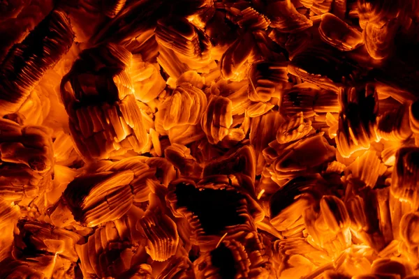 Burning embers in the dark — Stock Photo, Image