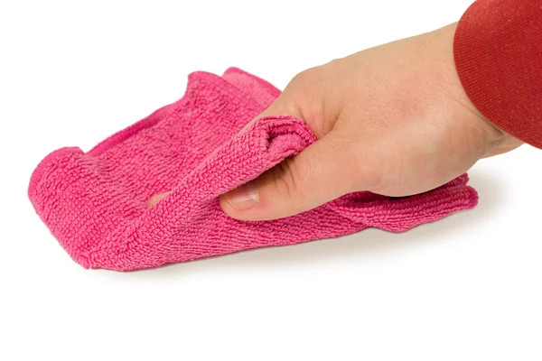 Mão segurando uma esponja magenta e limpe a poeira — Fotografia de Stock