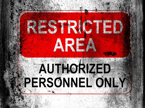 Restricted area sign painted on board with grungy dirty stains all over it — Stock Photo, Image