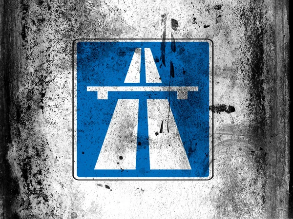 Autobahn road sign painted on board with grungy dirty stains all over it — Stock Photo, Image