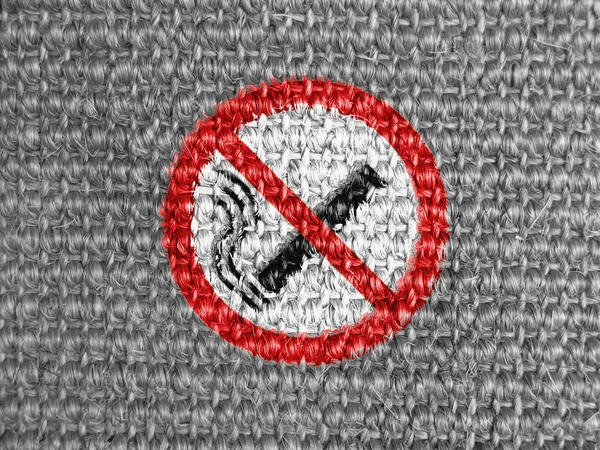 No smoking sign drawn at grey fabric — Stock Photo, Image