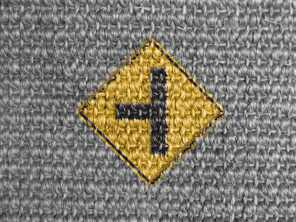 Side road sign painted on grey fabric — Stock Photo, Image