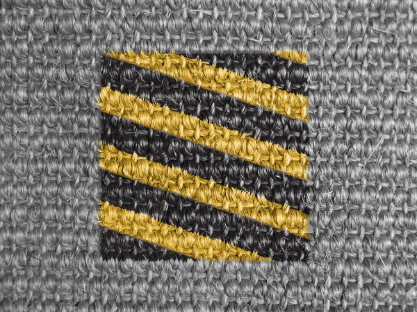 Warning road sign painted on grey fabric — Stock Photo, Image