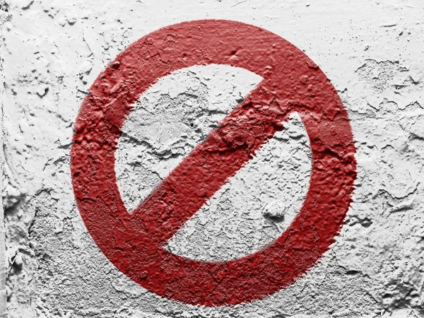 Forbidden sign painted on grunge wall — Stock Photo, Image