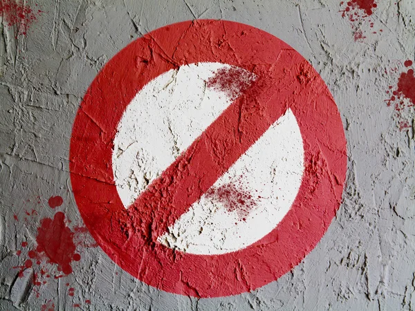 Forbidden sign painted on wall — Stock Photo, Image