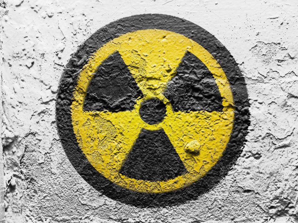 Nuclear radiation symbol painted on grunge wall