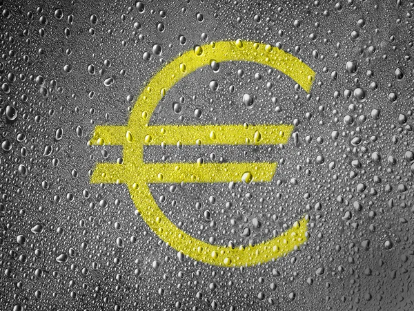 Euro currency sign painted on metal surface covered with rain drops