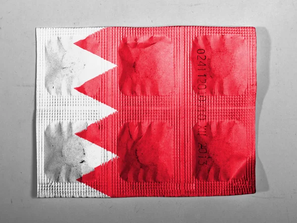 Bahrain. Bahraini flag painted on pills — Stock Photo, Image