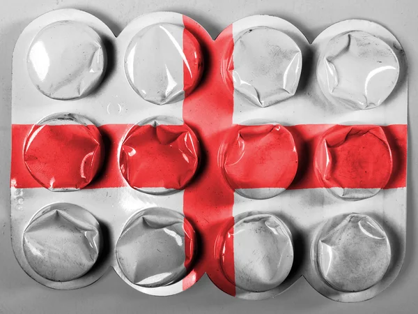 England. Svenska flaggan målad på tabletter eller piller — Stockfoto