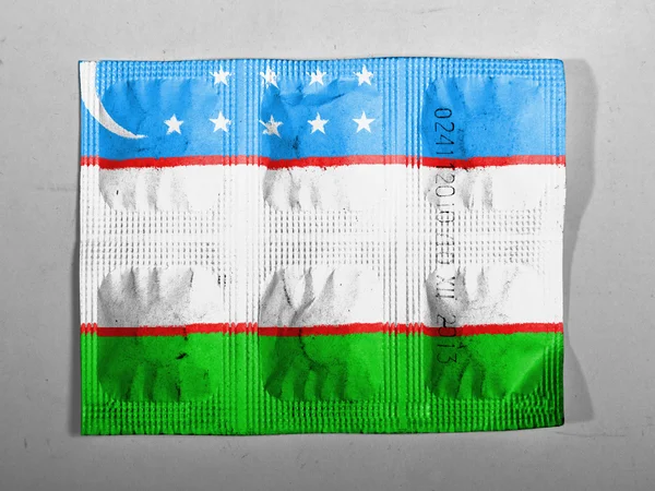 Bandiera Uzbekistan dipinta su pillole — Foto Stock