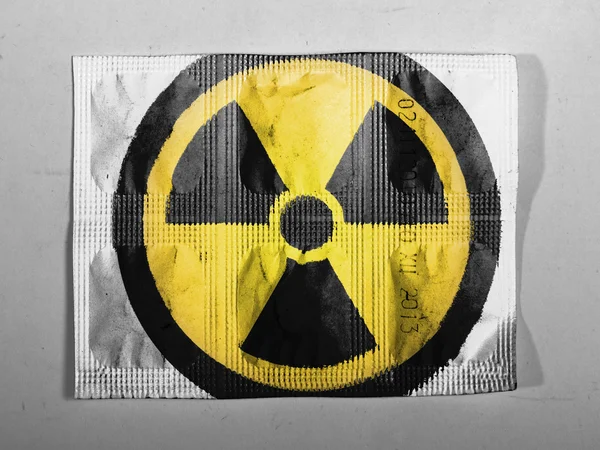 Nuclear radiation symbol painted on painted on pills — Stock Photo, Image