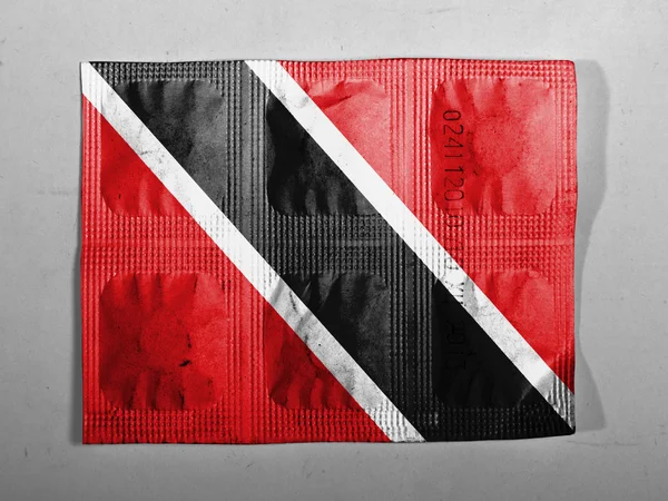 Bandeira de Trinidad e Tobago pintada em comprimidos — Fotografia de Stock