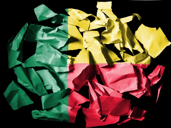 Benin. Benini flag painted on pieces of torn paper on black background — Stock Photo, Image