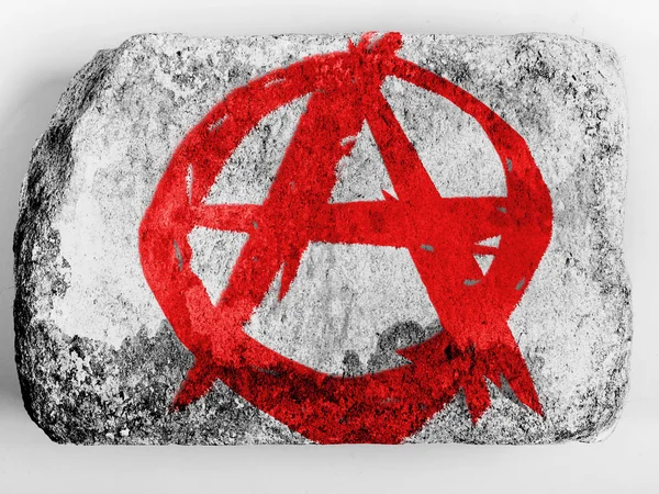 Símbolo de anarquía pintado n pintado sobre ladrillo — Foto de Stock
