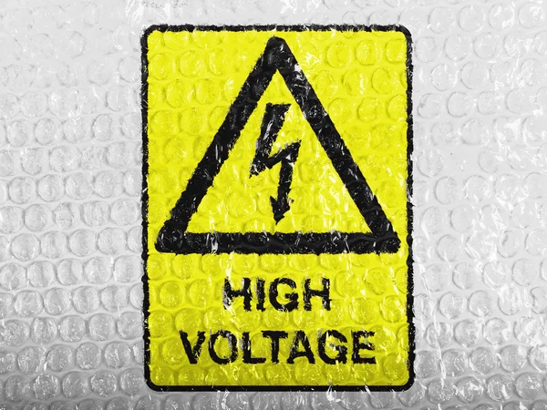 High voltage sign drawn at painted on bubblewrap — Stock Photo, Image