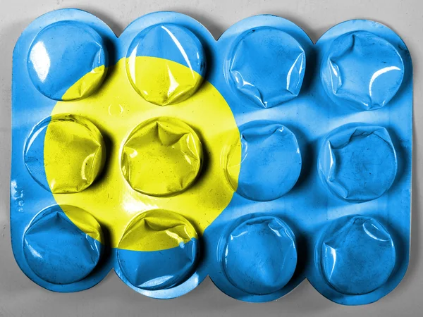Bandera de Palau pintada en tabletas o pastillas —  Fotos de Stock