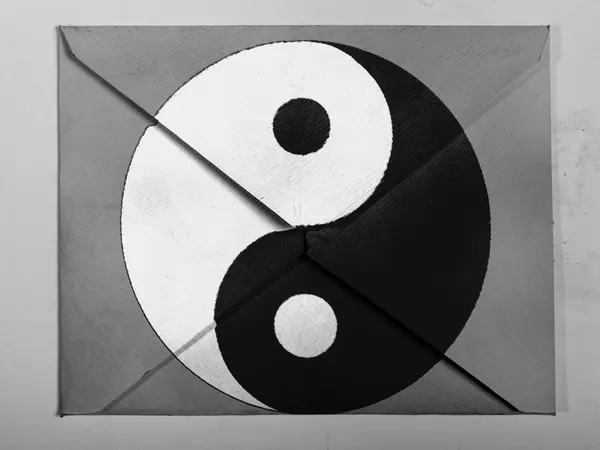 The Ying Yang sign painted on painted on grey envelope — Stock Photo, Image