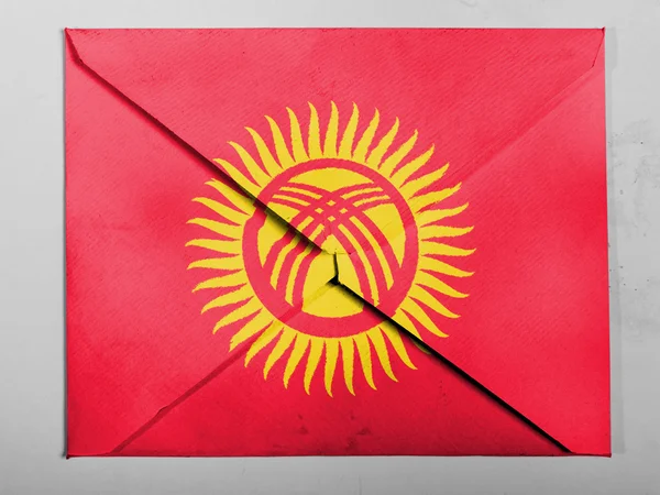 Kyrgyzstan flag painted on grey envelope — Stock Photo, Image