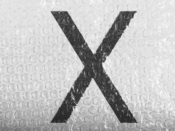 X brev målade på bubblewrap — Stockfoto