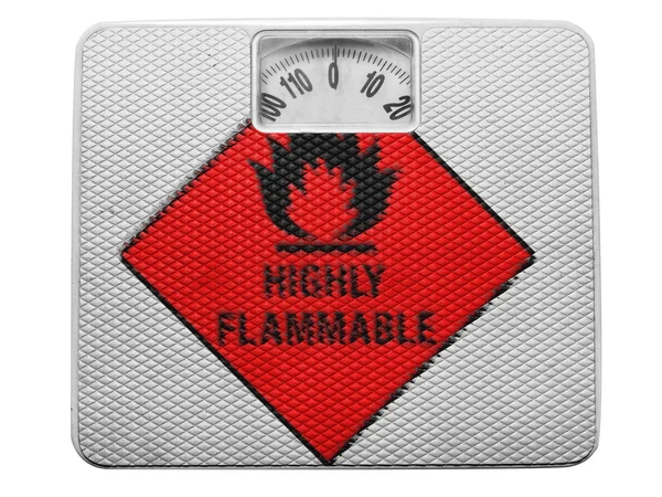 Highly flammable sign drawn on painted on balance — Stock Photo, Image