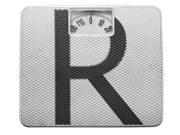 Буква R нарисована на весах — стоковое фото