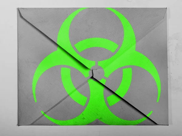 Biohazard sign painted on painted on grey envelope — Stock Photo, Image