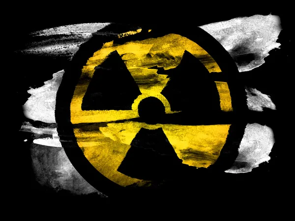 Símbolo de radiação nuclear pintado em papel texturizado preto com aquarela — Fotografia de Stock