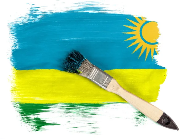 Ruanda bandery malowane pędzlem nad nim — Zdjęcie stockowe