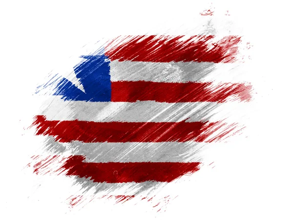 Liberia. Liberianische Flagge mit Pinsel auf weißem Hintergrund bemalt — Stockfoto