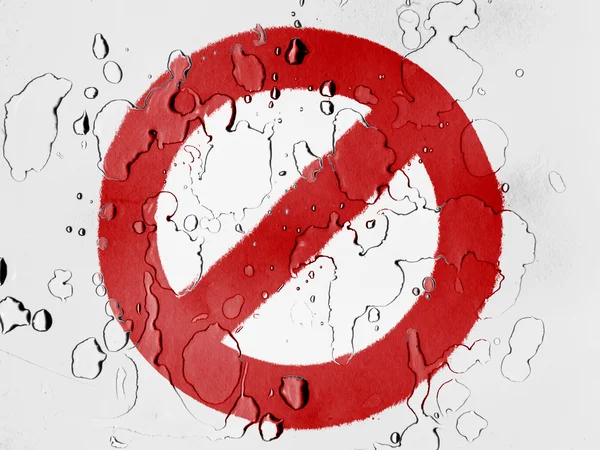 Forbidden sign painted on covered with water drops — Stock Photo, Image
