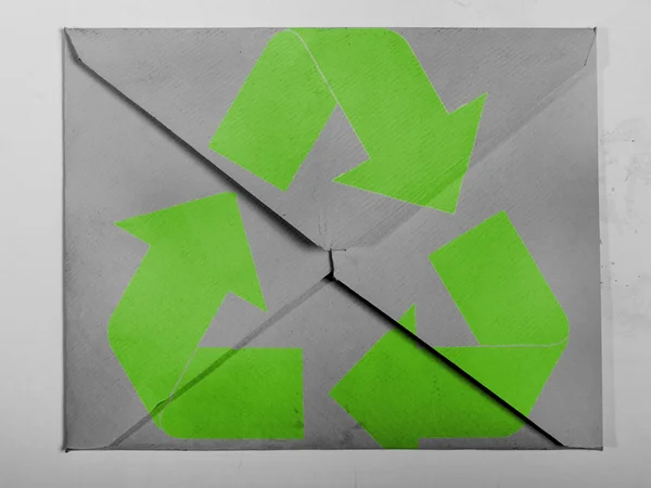 Recycle symbol painted on painted on grey envelope — Stock Photo, Image