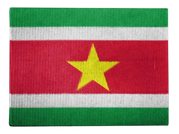 Bandeira do Suriname pintada em caixa de papelão — Fotografia de Stock