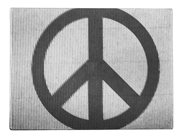 Peace symbol painted on painted on carton box — Stock Photo, Image