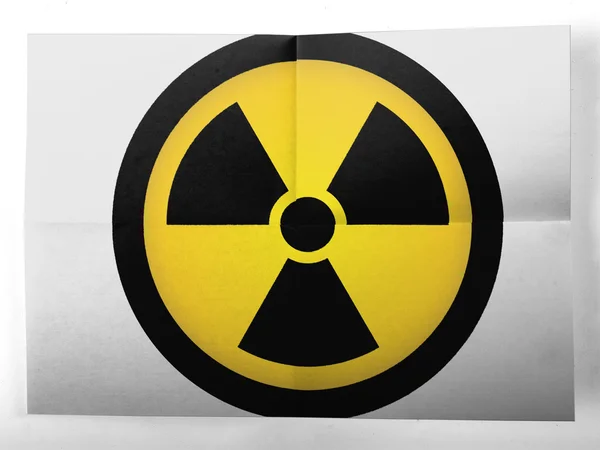 Festett egyszerű papírlap a nukleáris sugárzás-szimbólum — Stock Fotó