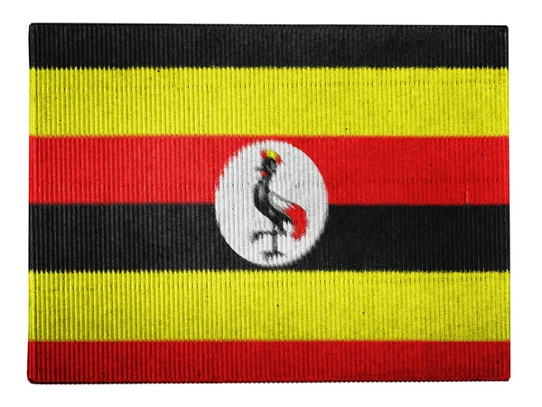 Bandera Uganda pintada en caja de cartón —  Fotos de Stock