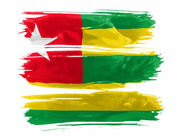 Togo-Flagge mit drei weißen Farbstrichen bemalt — Stockfoto