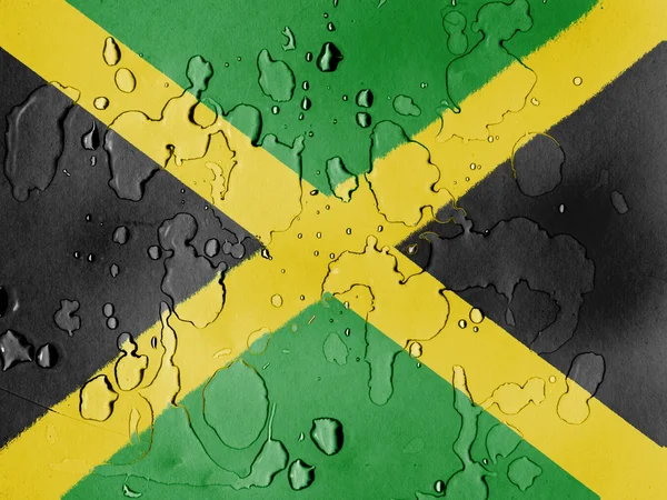 Jamaica flagga täckt med vattendroppar — Stockfoto