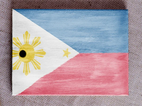 Philippinische Flagge über Holzbrett gemalt — Stockfoto