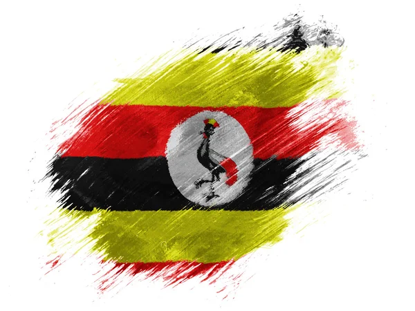 Ugandas Flagge mit Pinsel auf weißem Hintergrund gemalt — Stockfoto