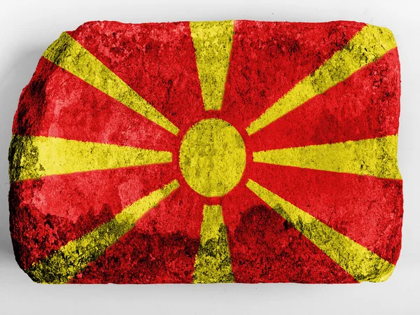Vlajka Makedonie na cihlyレンガに描かれたマケドニアの旗 — Stock fotografie