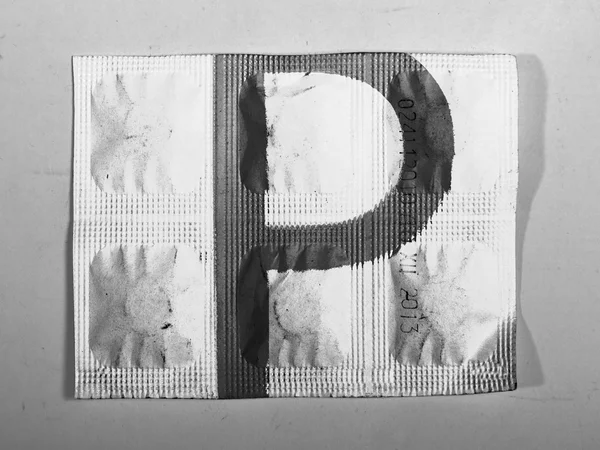 P letter painted on pills — Stock Photo, Image