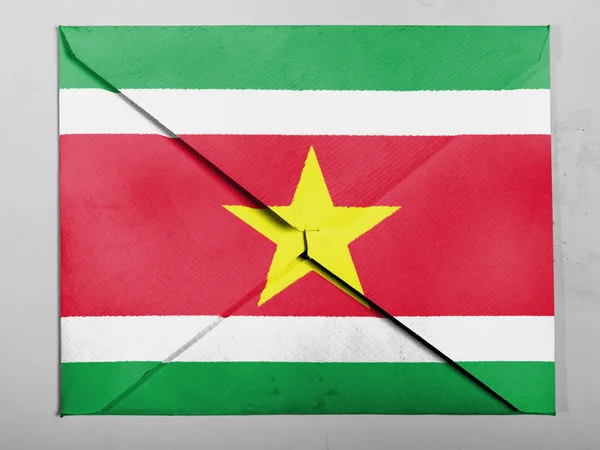 Surinamese flag painted on grey envelope — Stock Photo, Image