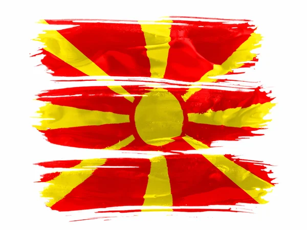 Macedonië vlag geschilderd met drie lijnen van verf in wit — Stockfoto