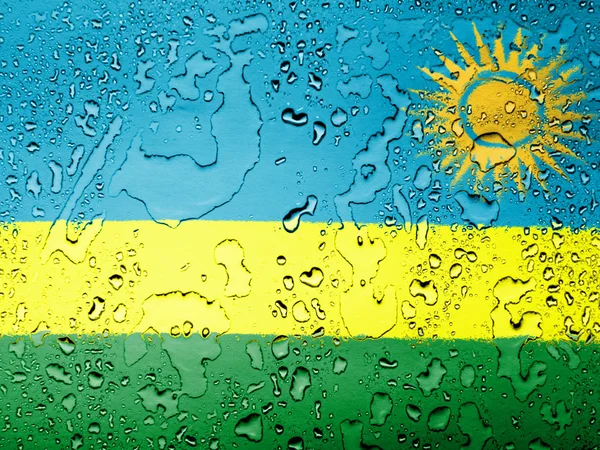 Su damlaları ile kaplı ruanda bayrağı — Stok fotoğraf