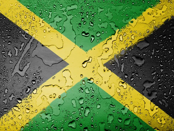 Jamaica flagga täckt med vattendroppar — Stockfoto