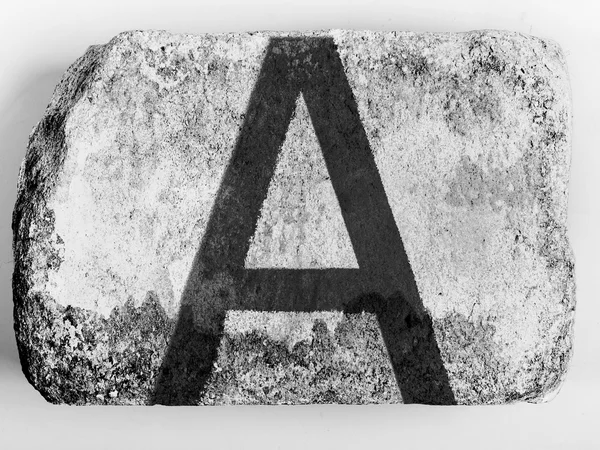 A letter painted on brick — Stock Photo, Image