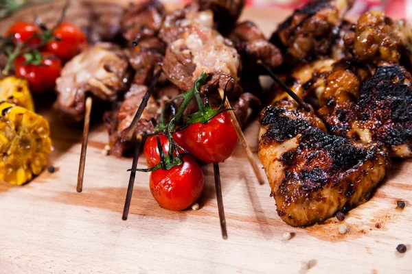 Set of grilled meat on wooden board — Stock Photo, Image