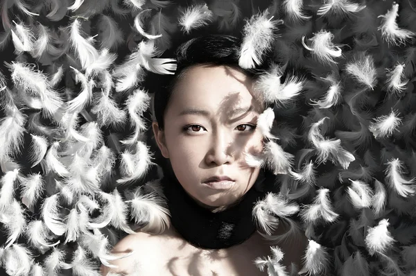 Girl with feathers — Stock Photo, Image